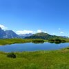 Blue eye an a green landscape: the Lech da Iman reflects the sky above the Val Gardena valley - Foto: AT, &copy; Peer